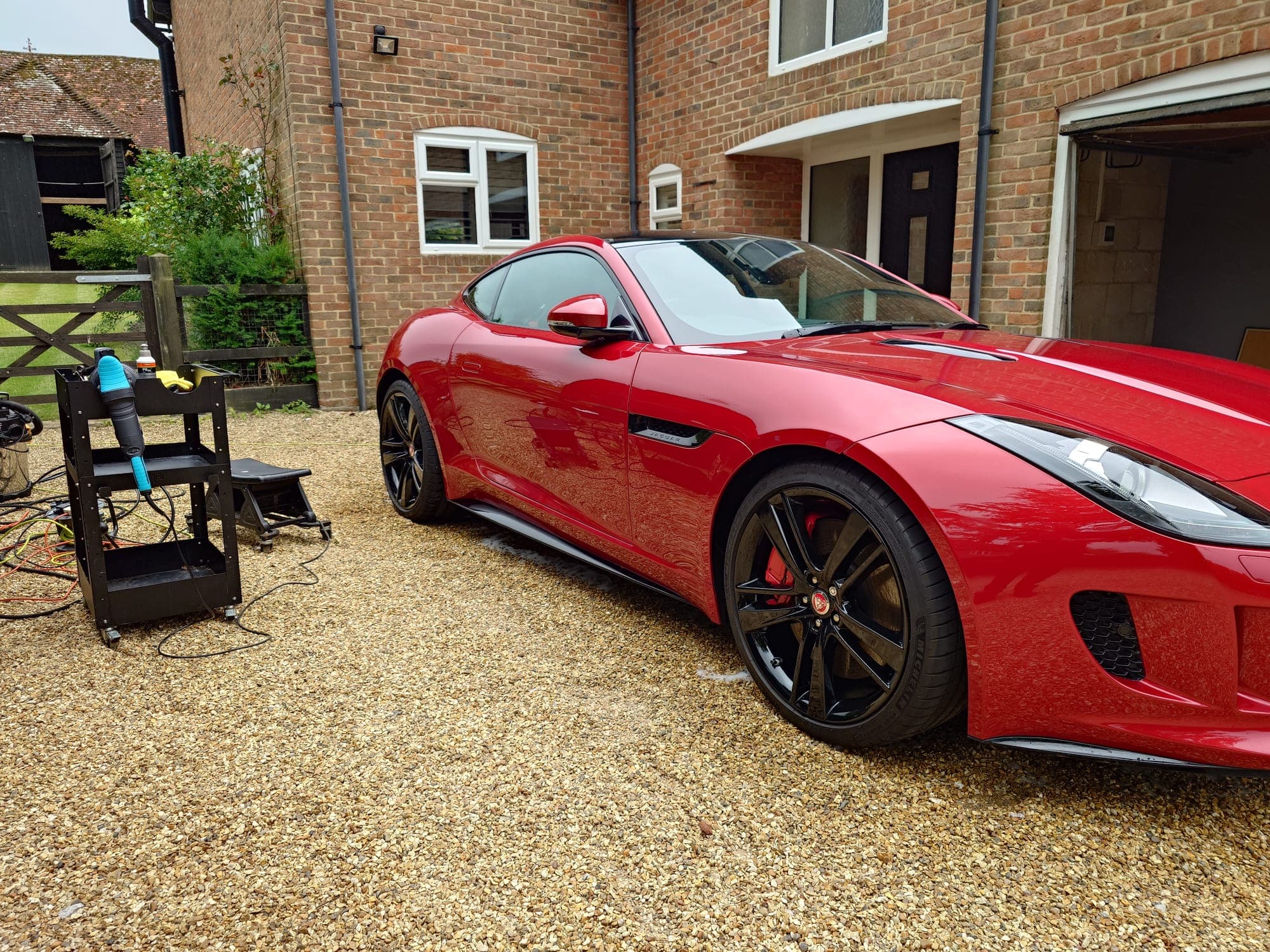 a jaguar car with reflection of tools through the shine applied by eclipse detailing